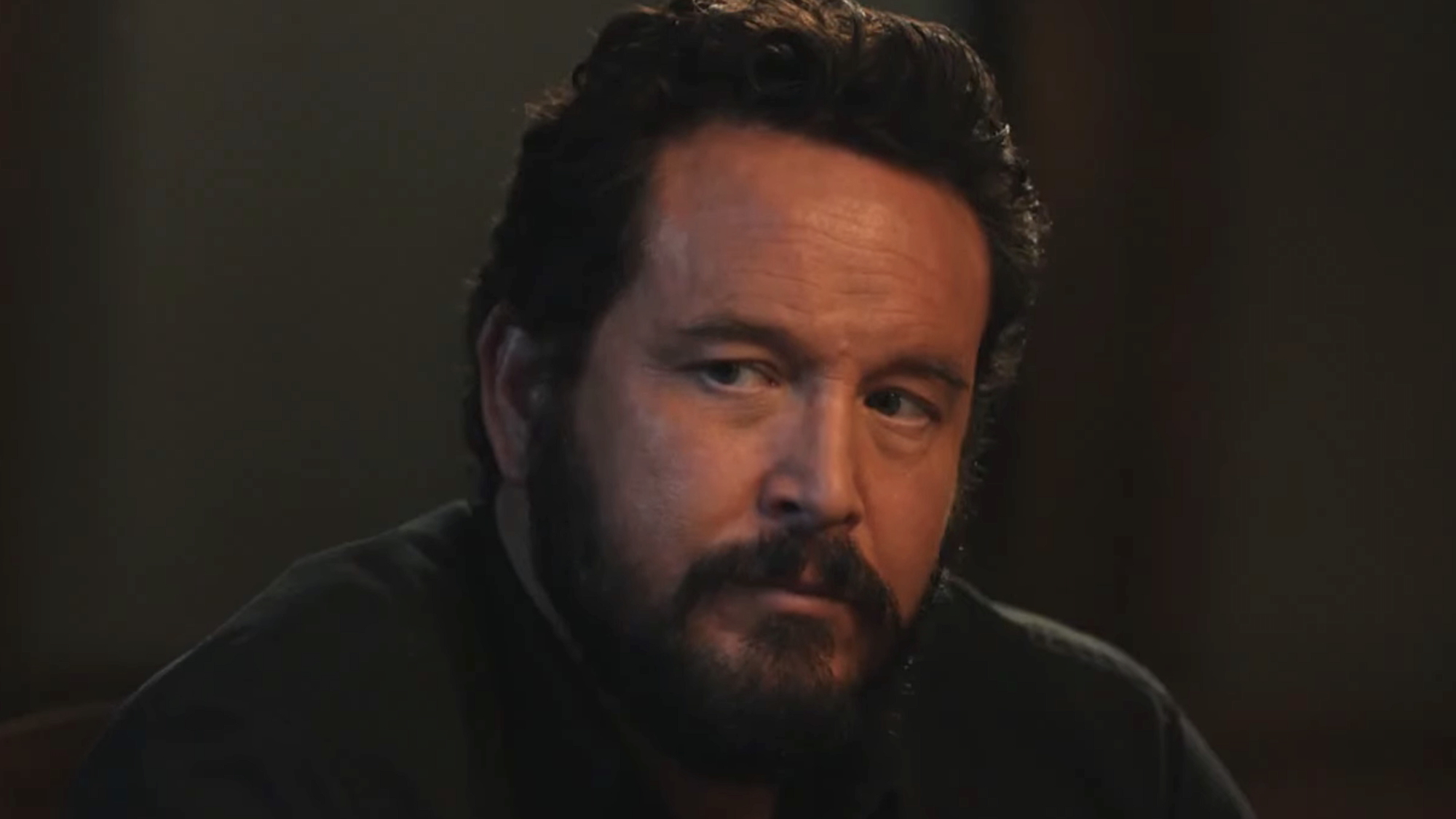Close-up on Rip looking intently at Beth in Dutton Ranch Season 1