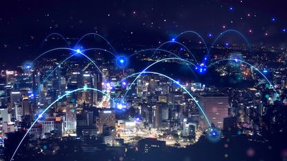 5G networks transferring mobile data across cities.