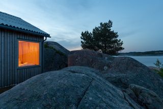 modest cabin at dusk in norway