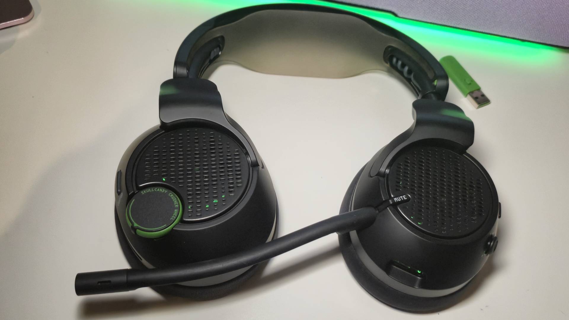 Photo of the Skullcandy Crusher PLYR 720 wireless gaming headset sitting on a white desk.
