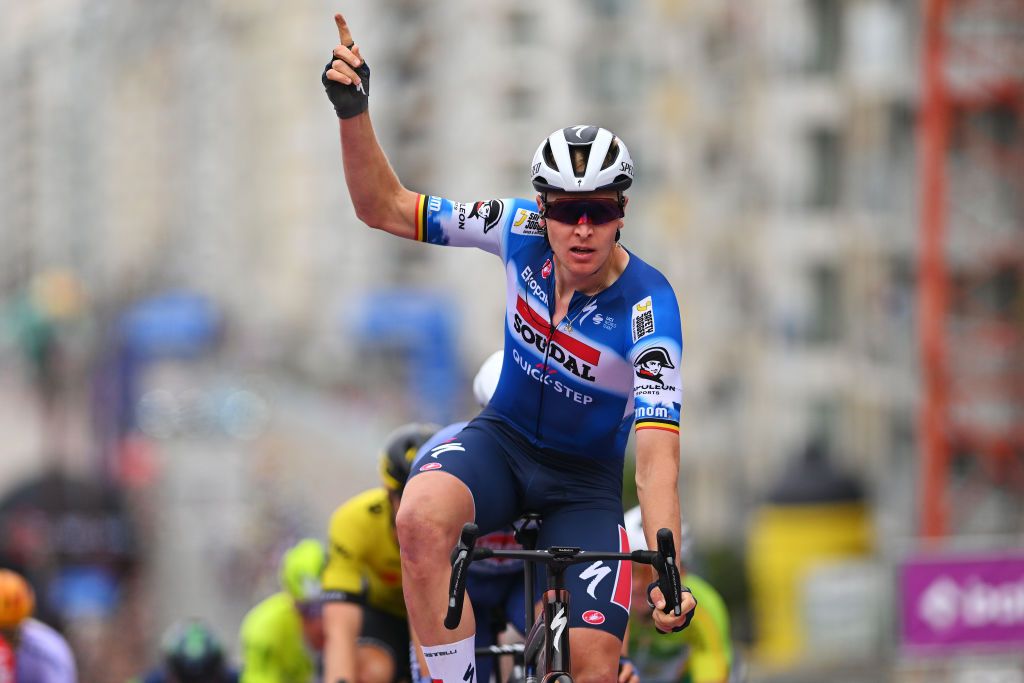 KNOKKEHEIST BELGIUM JUNE 13 Tim Merlier of Belgium and Team Soudal QuickStep celebrates at finish line as stage winner during the 93rd Baloise Belgium Tour 2024 Stage 2 a 1842km stage from Merelbeke to KnokkeHeist on June 13 2024 in KnokkeHeist Belgium Photo by Luc ClaessenGetty Images