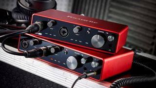 A pair of Focusrite interfaces stacked on top of each other in a studio