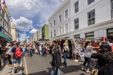 Shoppers on Portobello Road symbolising UK inflation