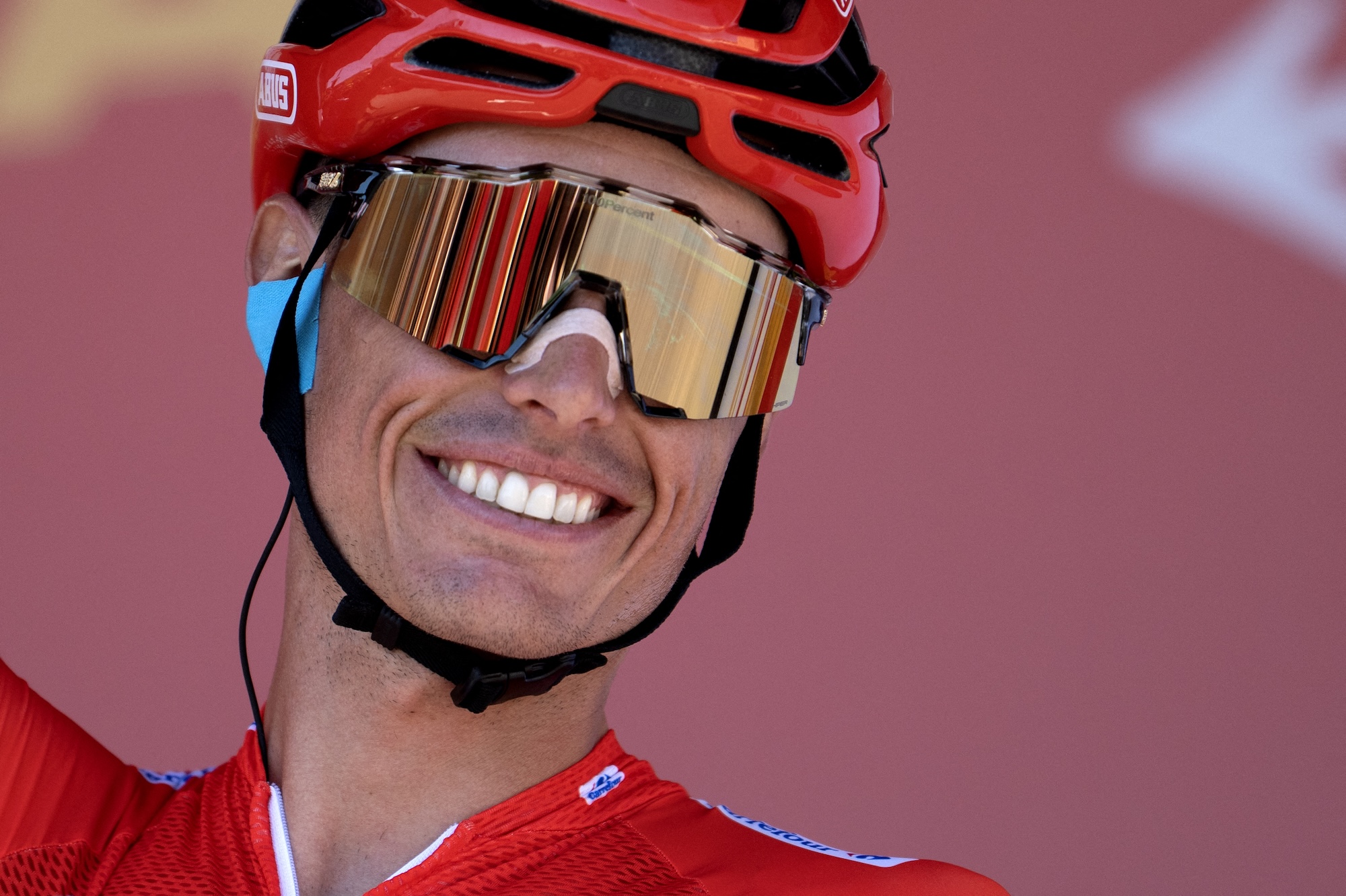 Enric Mas carries the red leader's jersey into stage 21 held in Granada on Sunday
