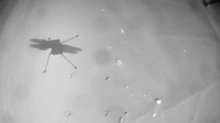 shadow of helicopter on ground of mars in black and white