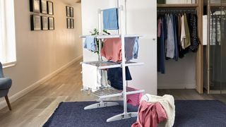 heated clothes airer drying clothes in bedroom