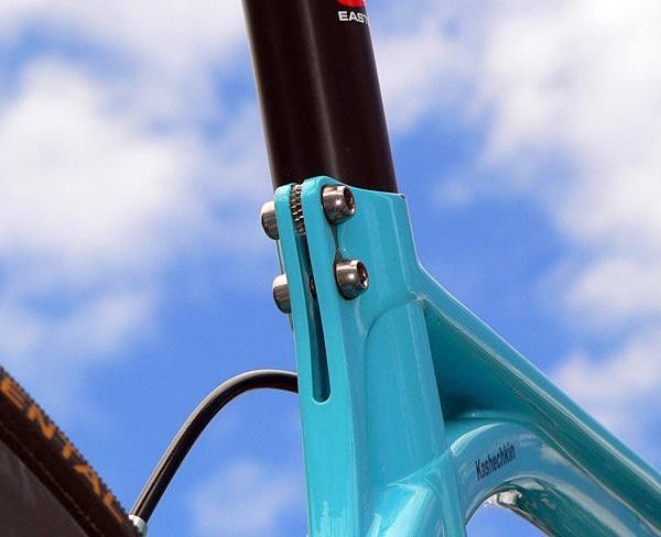 A couple of small washers inserted in the seat tube slot
