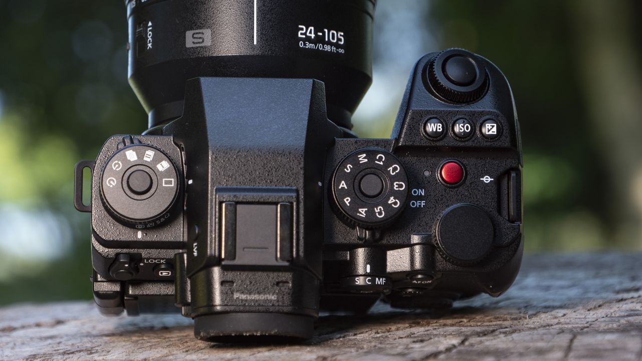 Top of Panasonic Lumix S1 II mirrorless camera outdoors on a wooden surface