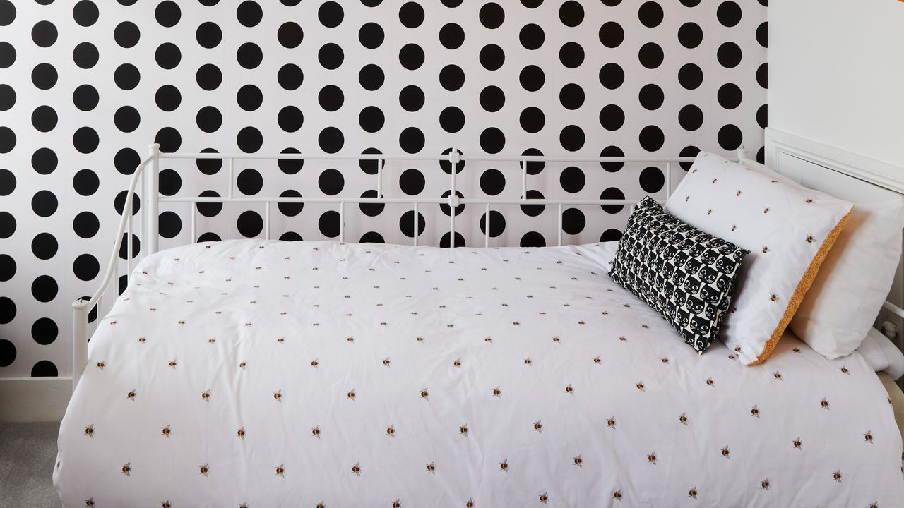 Bedroom with a polka dot wallpaper