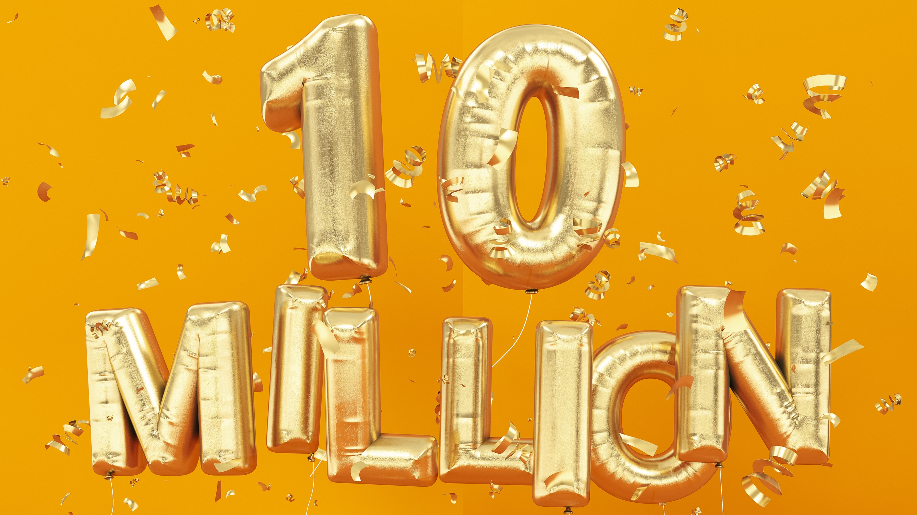Gold balloons spell out "10 million."