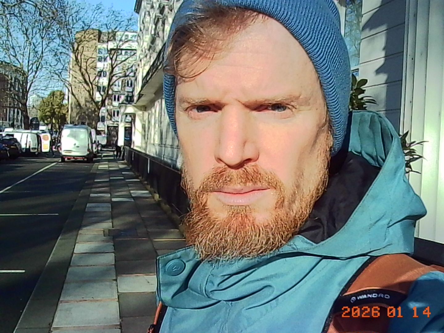 Kodak Charmera sample gallery: man in a beanie hat, early morning light, urban street