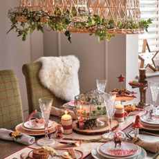 dining room with dining table and chairs and printed tableware