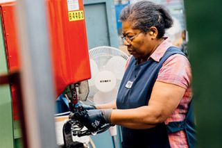 Sonia Thomas, Brooks’s longest serving employee, operating a riveting machine