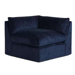 A blue chenille modular corner chair