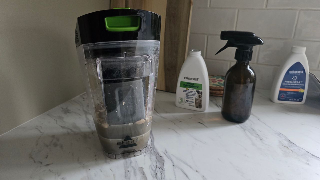 Bissell CrossWave HydroSteam Pet dirty water tank on kitchen counter