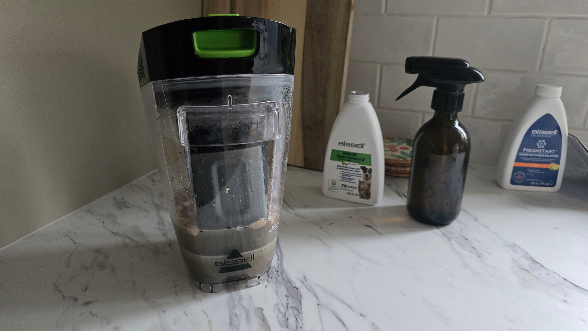 Bissell CrossWave HydroSteam Pet dirty water tank on kitchen counter
