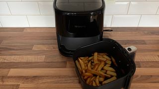 The Proscenic T22 Air Fryer with fries in the frying basket