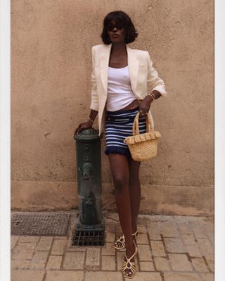 striped skirt + linen blazer — what women wear while shopping in europe