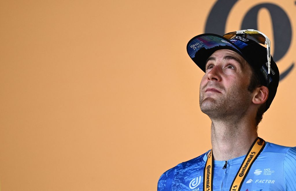 IsraelPremier Tech teams Canadian rider Hugo Houle celebrates on the podium after winning the 16th stage of the 109th edition of the Tour de France cycling race 1785 km between Carcassonne and Foix in southern France on July 19 2022 Photo by Marco BERTORELLO AFP Photo by MARCO BERTORELLOAFP via Getty Images