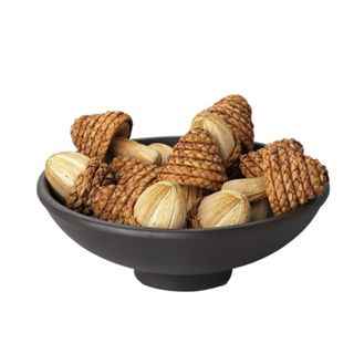 A bowl of acorn and mushroom decorations