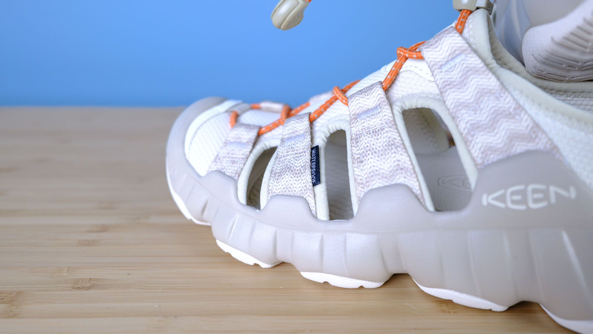 The Keen Hyperport H2 water hiking sandals with aquagrip soles, injected foam soles, and a cinch clasp for slip-on ease, in the taupe/coral colorway