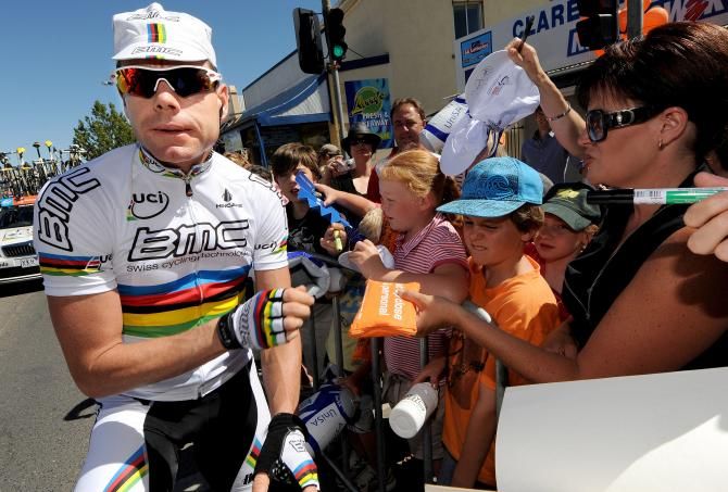 Cadel Evans signs a few autographs