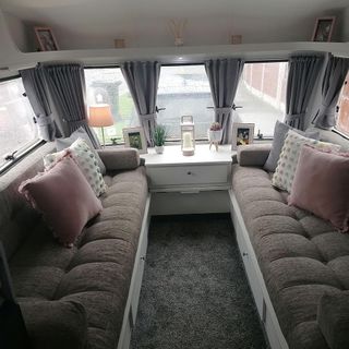 brown sofa set with cushion white drawer and window