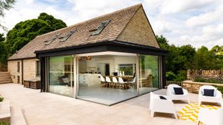 extension with stone slate roof and sliding doors