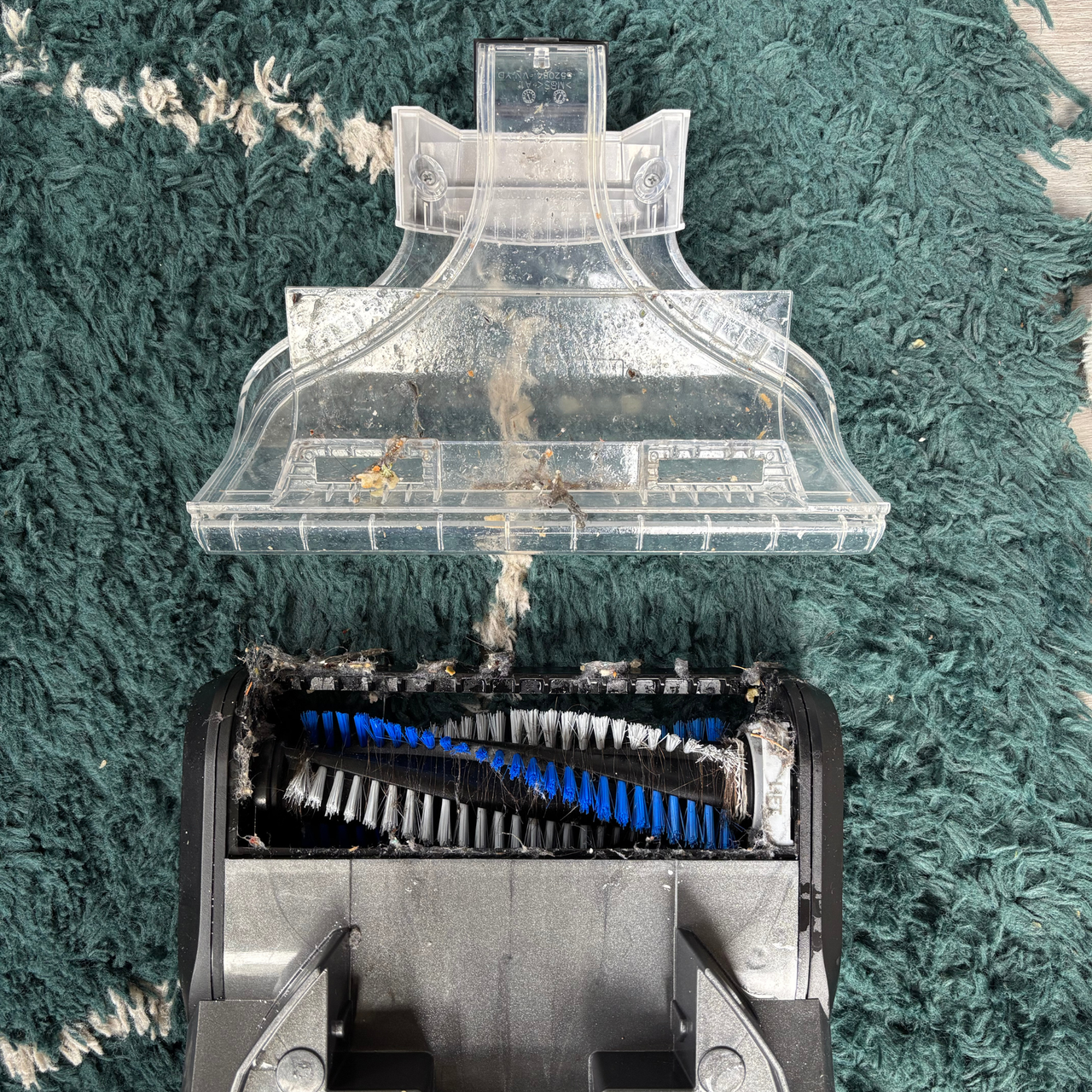 ONEPWR Cordless Compact Carpet Cleaner accessories removed to show build up of dirt and debris