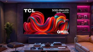 A wall-mounted TCL QM8L TV displaying colorful, abstract imagery in a dark living room that's illuminated by blue- and pink-colored lighting