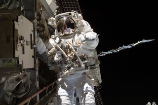 Steve Swanson on Spacewalk to Replace Relay Box on ISS