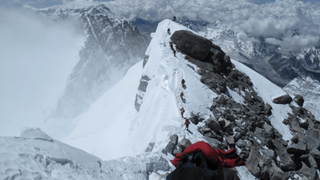 Vivian James Rigney making his way up Everest with hundreds of other climbers