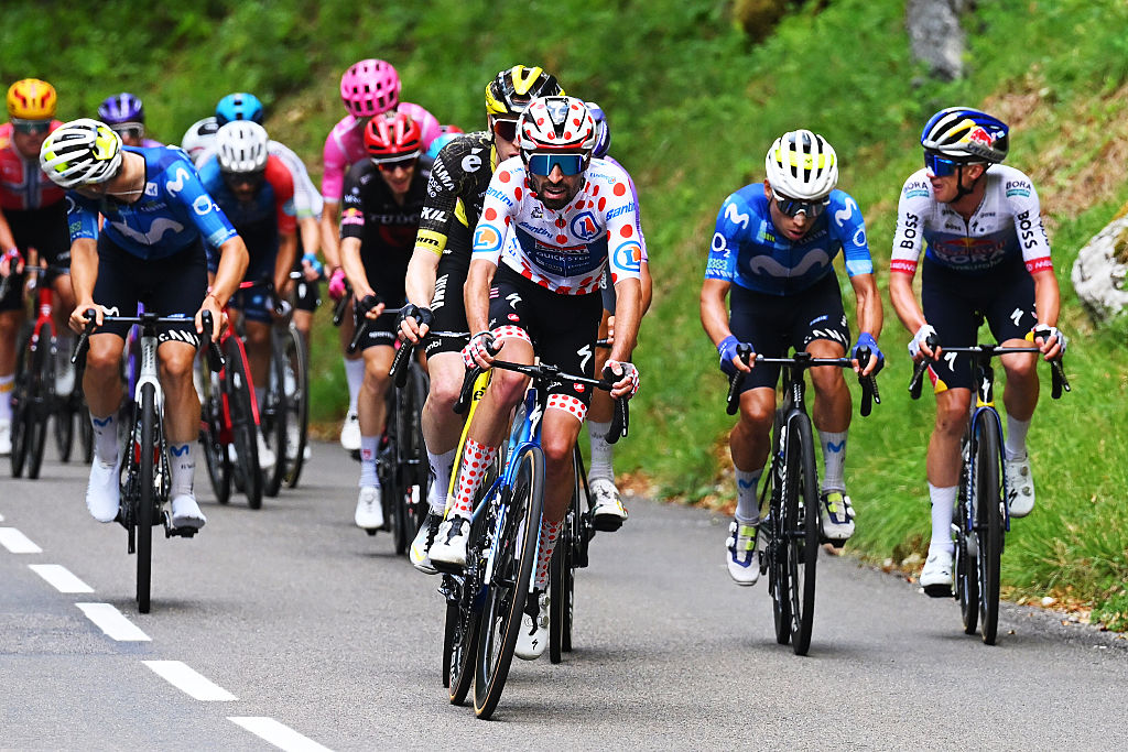 Valentin Paret-Peintre wears the polka dot jersey during stage 15