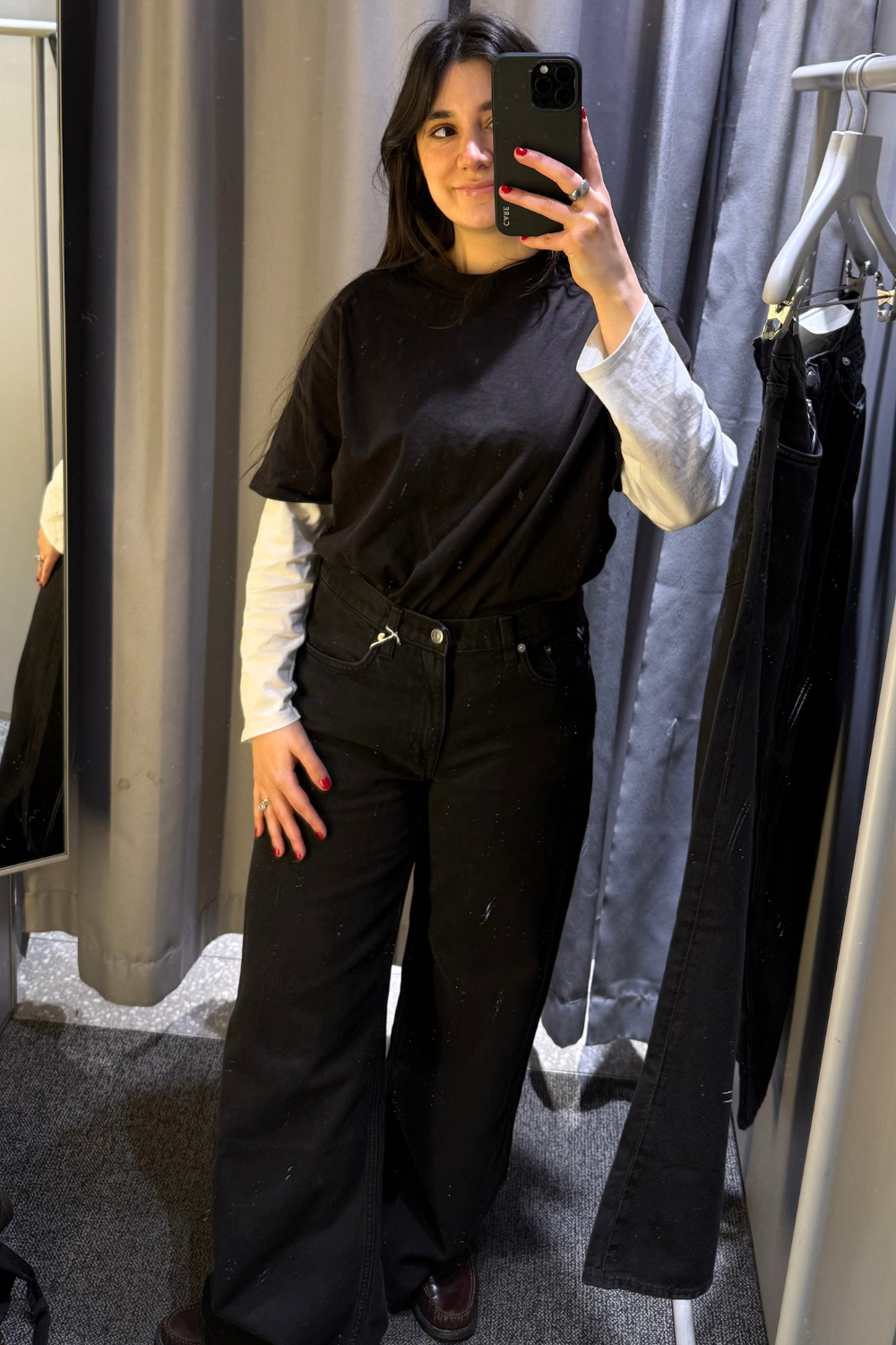 Sofia wearing black jeans from Arket