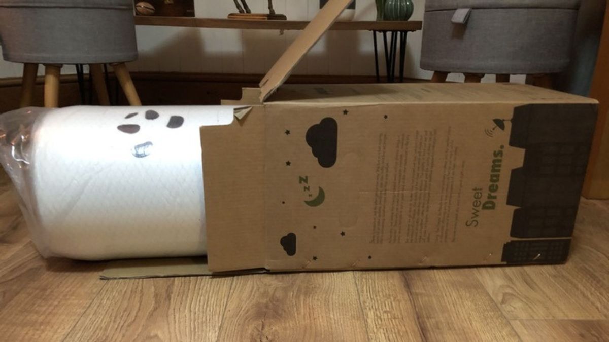 The Panda Bamboo 2" Memory Foam Mattress Topper being unboxed.