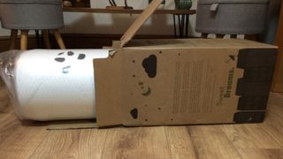 The Panda Bamboo 2" Memory Foam Mattress Topper being unboxed.