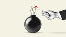 Hand with a match lighting a bomb
