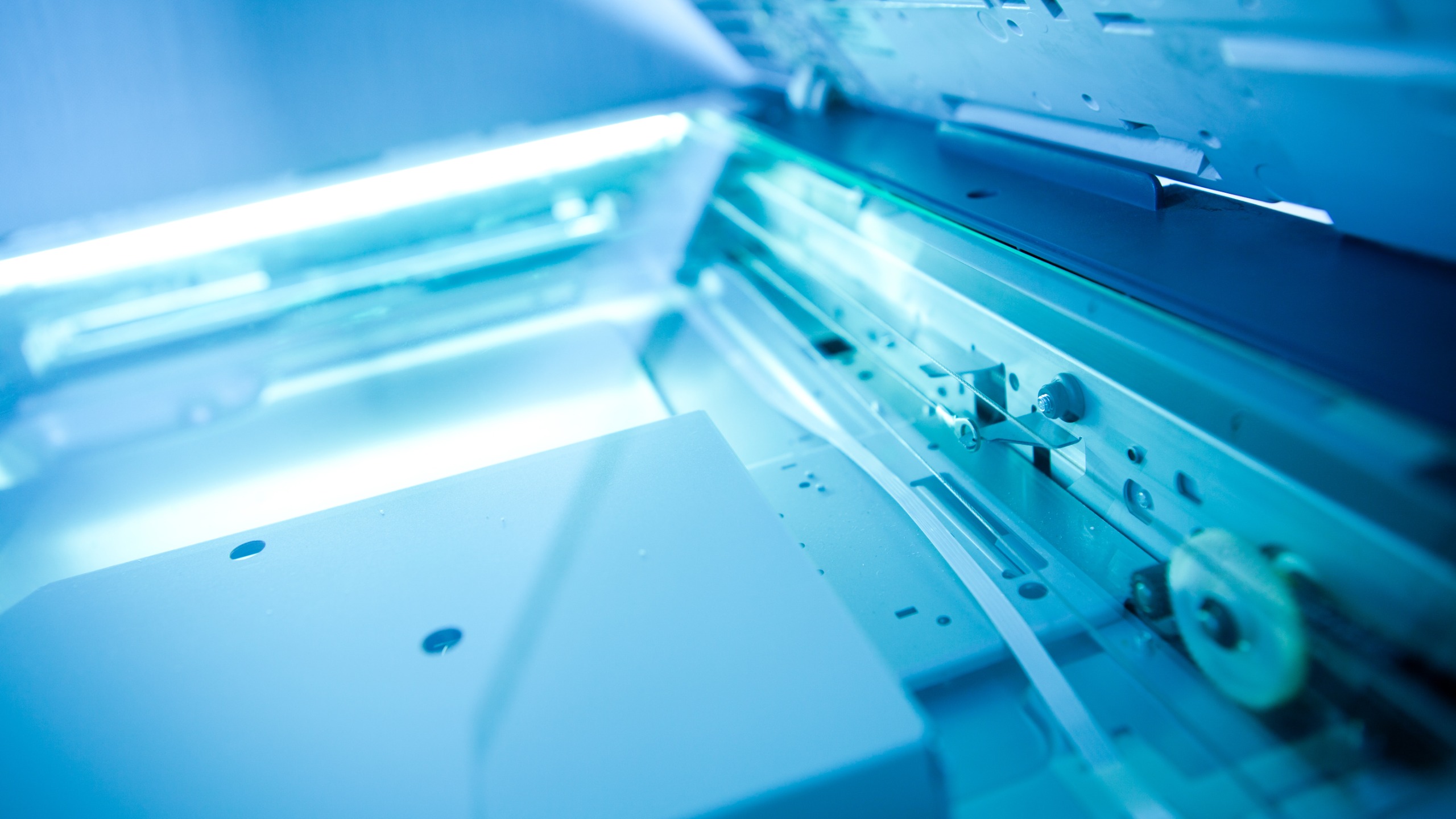 A photocopier scanning with the lid open