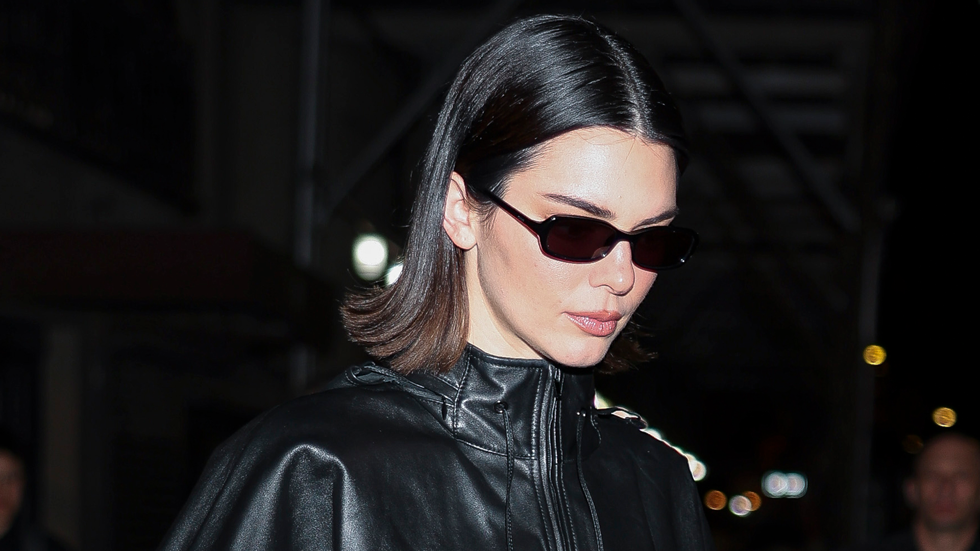 Kendall Jenner styled capri pants with a brown leather bag at Sushi Park