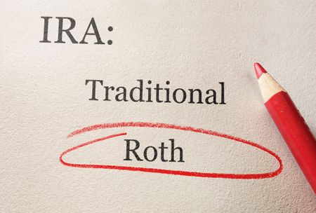 Traditional and Roth IRA circled in red pencil -- retirement concept