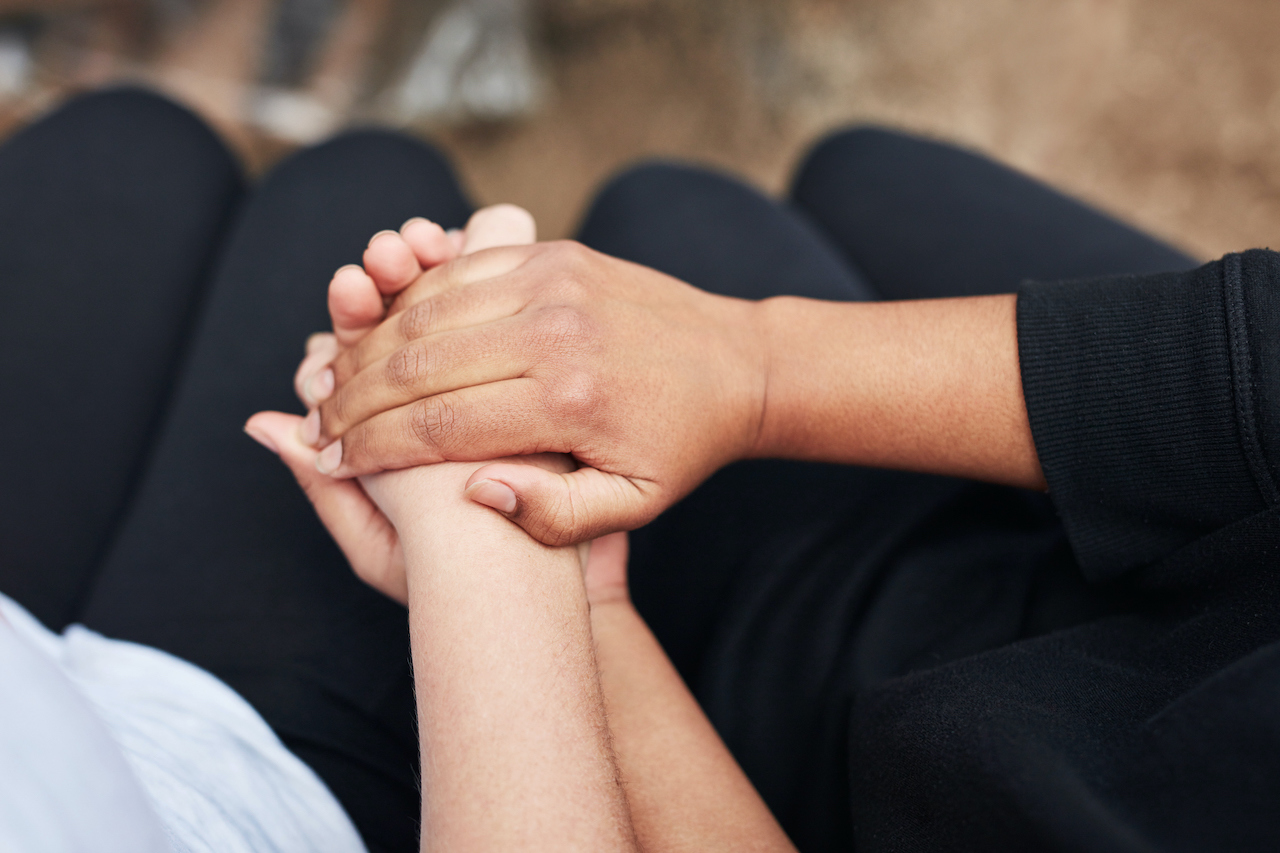 Couple holding hands