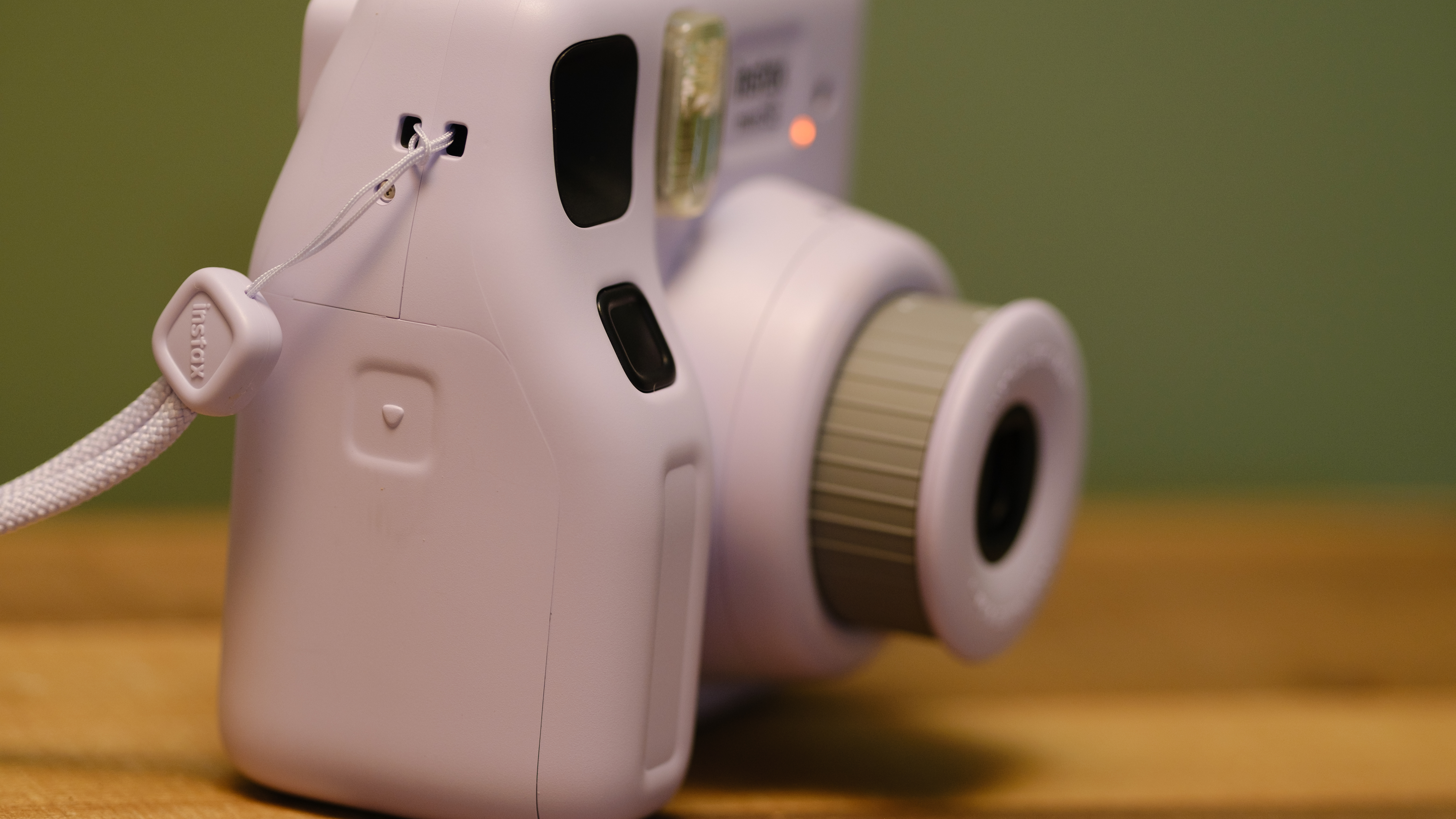 The Fujifilm Instax Mini SE view from the grip side