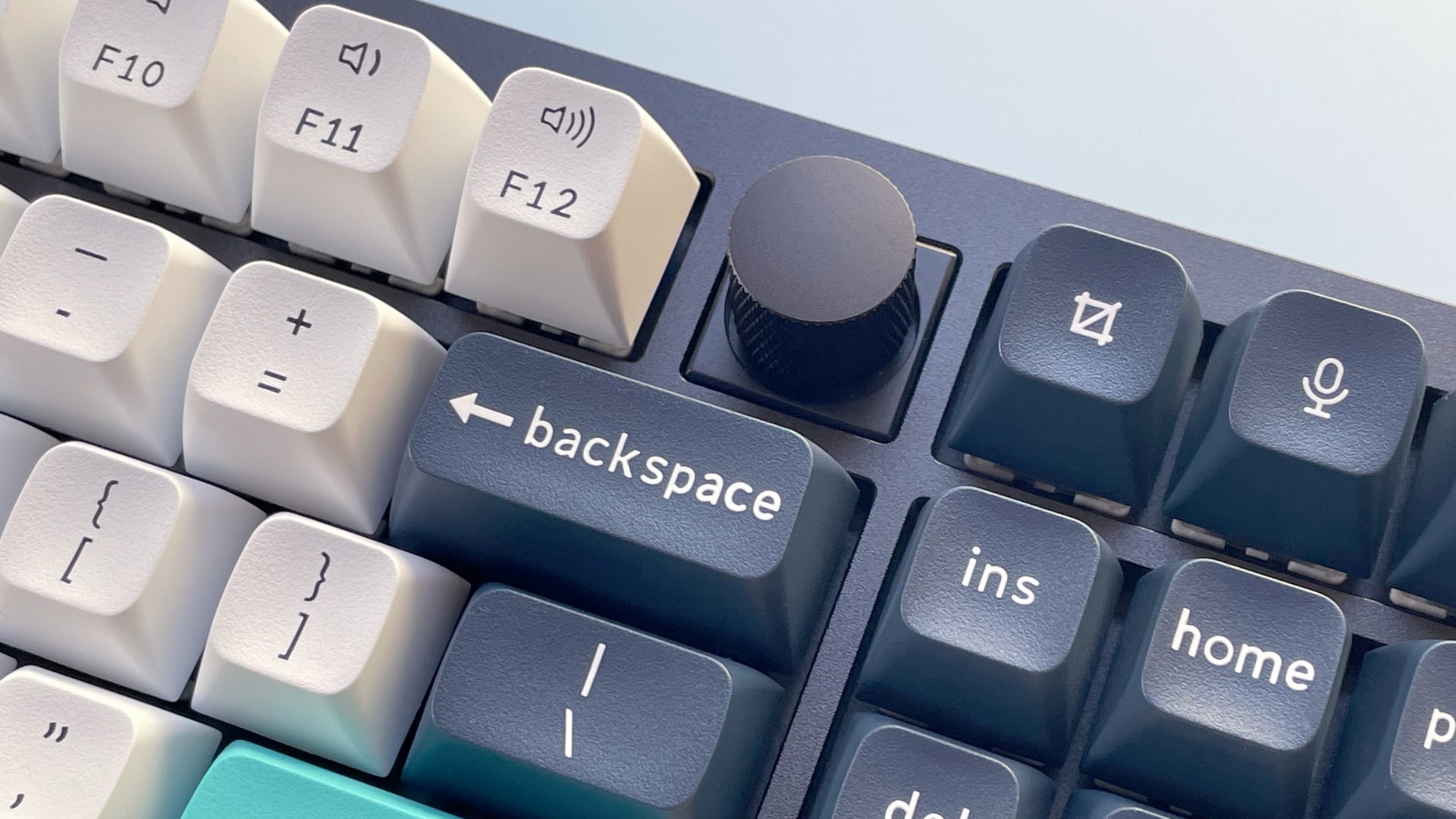 The Keychron Q6 Max mechanical keyboard against a blue background.