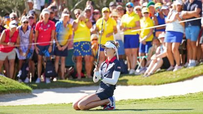 Nelly Korda on her knees after just missing a chip-in at the Solheim Cup
