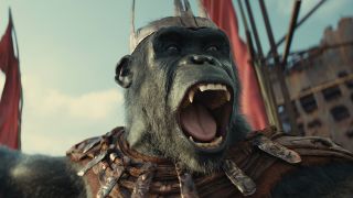 Still from the movie ' Kingdom of the Planet of the Apes' (2024). An ape with sharp teeth screaming a battle cry whilst wearing armor.