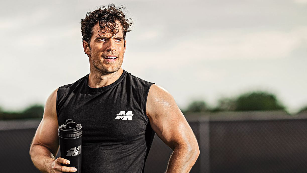 Henry Cavill having a Muscletech shake after a workout