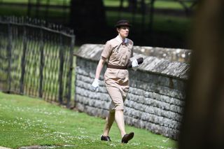 Nanny to Prince George and Princess Charlotte, Maria Borrallo, walks to the church ahead of the wedding of Pippa Middleton and James Matthews at St Mark's Church in Englefield