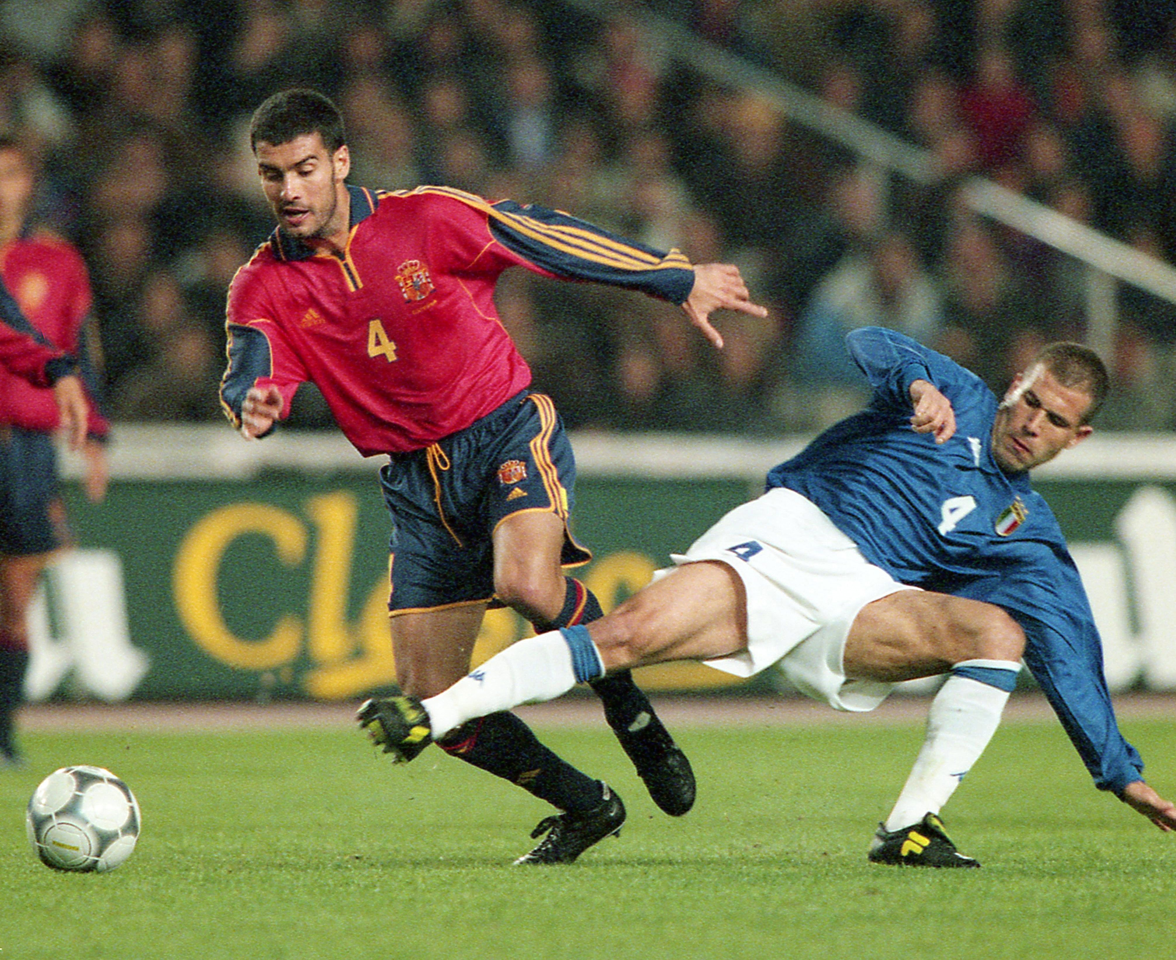 Pep Guardiola competes for the ball with Luigi Di Biagio in a friendly between Spain and Italy in March 2000.