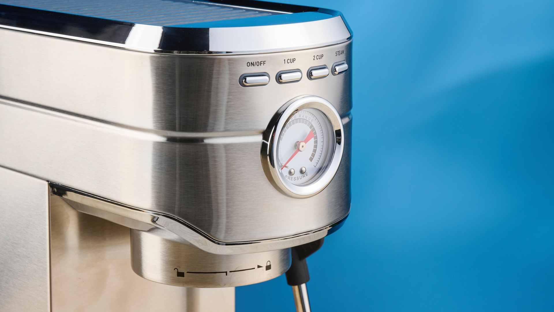 the casabrews cm5418 espresso machine in silver showing its steam wand and water tank and accessories