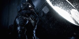 Armored Batman next to Bat-Signal in Batman v Superman